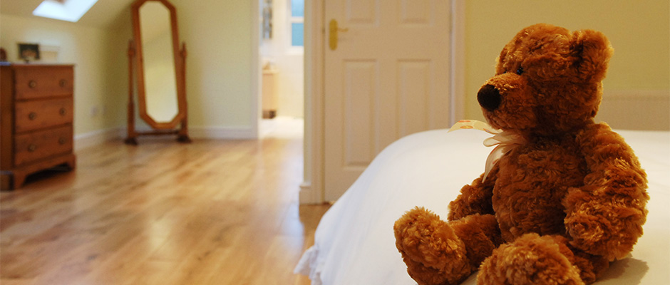 Teddy bear in loft conversion bedroom